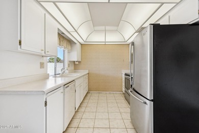 This Sun City home has 3 bedrooms and 2 updated bathrooms on Sun City Lakes West and East in Arizona - for sale on GolfHomes.com, golf home, golf lot