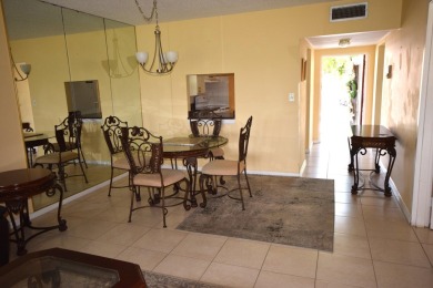 Enjoy serene golf course views and resort-style amenities in on Oriole Golf and Tennis Club in Florida - for sale on GolfHomes.com, golf home, golf lot