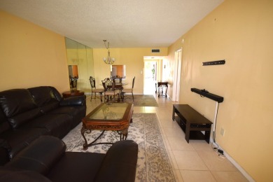 Enjoy serene golf course views and resort-style amenities in on Oriole Golf and Tennis Club in Florida - for sale on GolfHomes.com, golf home, golf lot