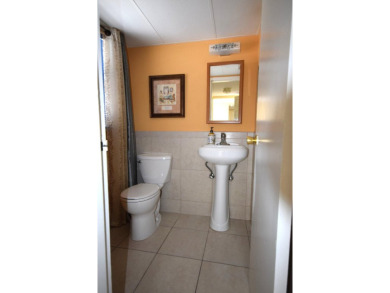 Enjoy serene golf course views and resort-style amenities in on Oriole Golf and Tennis Club in Florida - for sale on GolfHomes.com, golf home, golf lot