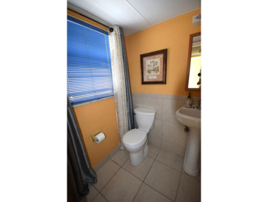 Enjoy serene golf course views and resort-style amenities in on Oriole Golf and Tennis Club in Florida - for sale on GolfHomes.com, golf home, golf lot