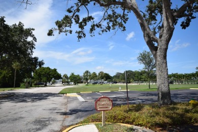Enjoy serene golf course views and resort-style amenities in on Oriole Golf and Tennis Club in Florida - for sale on GolfHomes.com, golf home, golf lot