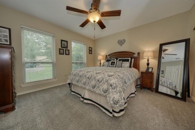Nestled directly on the scenic Golf Course in Hideaway, this on Hide-A-Way Lake Golf Course in Texas - for sale on GolfHomes.com, golf home, golf lot