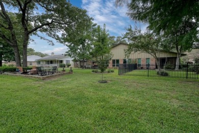 Nestled directly on the scenic Golf Course in Hideaway, this on Hide-A-Way Lake Golf Course in Texas - for sale on GolfHomes.com, golf home, golf lot