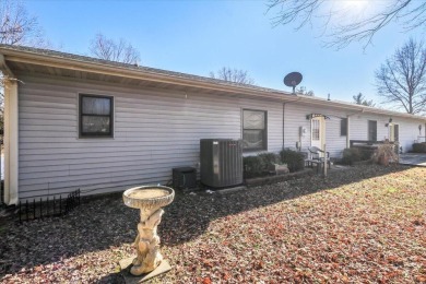 This 3-bedroom, 2-bathroom home sits on a corner lot in the on West Plains Country Club in Missouri - for sale on GolfHomes.com, golf home, golf lot