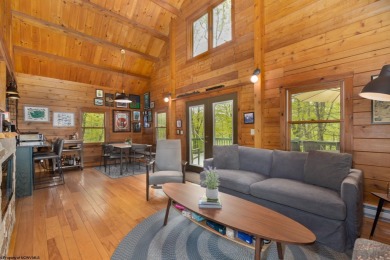 Escape to 'Rustic Refuge', a charming LOG CHALET nestled within on Alpine Lake Resort in West Virginia - for sale on GolfHomes.com, golf home, golf lot