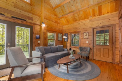 Escape to 'Rustic Refuge', a charming LOG CHALET nestled within on Alpine Lake Resort in West Virginia - for sale on GolfHomes.com, golf home, golf lot
