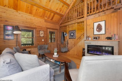 Escape to 'Rustic Refuge', a charming LOG CHALET nestled within on Alpine Lake Resort in West Virginia - for sale on GolfHomes.com, golf home, golf lot
