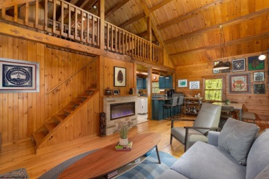 Escape to 'Rustic Refuge', a charming LOG CHALET nestled within on Alpine Lake Resort in West Virginia - for sale on GolfHomes.com, golf home, golf lot