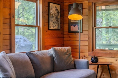 Escape to 'Rustic Refuge', a charming LOG CHALET nestled within on Alpine Lake Resort in West Virginia - for sale on GolfHomes.com, golf home, golf lot