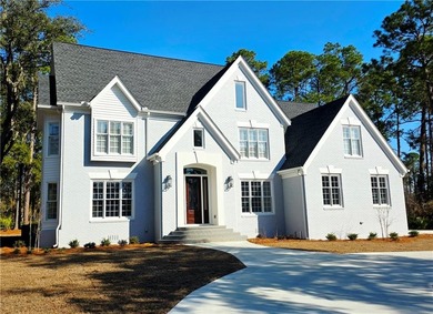 Perfectly positioned on the 18th tee box of the prestigious on Okefenokee Country Club in Georgia - for sale on GolfHomes.com, golf home, golf lot