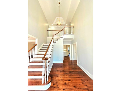 Perfectly positioned on the 18th tee box of the prestigious on Okefenokee Country Club in Georgia - for sale on GolfHomes.com, golf home, golf lot