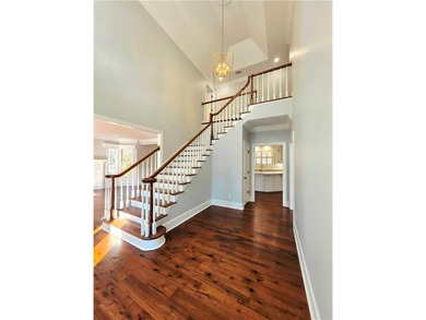 Perfectly positioned on the 18th tee box of the prestigious on Okefenokee Country Club in Georgia - for sale on GolfHomes.com, golf home, golf lot