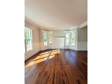 Perfectly positioned on the 18th tee box of the prestigious on Okefenokee Country Club in Georgia - for sale on GolfHomes.com, golf home, golf lot