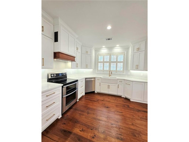 Perfectly positioned on the 18th tee box of the prestigious on Okefenokee Country Club in Georgia - for sale on GolfHomes.com, golf home, golf lot