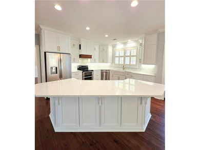 Perfectly positioned on the 18th tee box of the prestigious on Okefenokee Country Club in Georgia - for sale on GolfHomes.com, golf home, golf lot