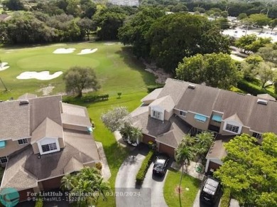 Welcome to this beautiful end unit located on the 5th green of on Woodmont Country Club in Florida - for sale on GolfHomes.com, golf home, golf lot