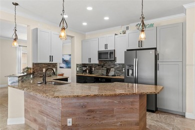 Beautiful Water-View Pool Home in Gated Golf Course Community - on Stoneybrook West in Florida - for sale on GolfHomes.com, golf home, golf lot