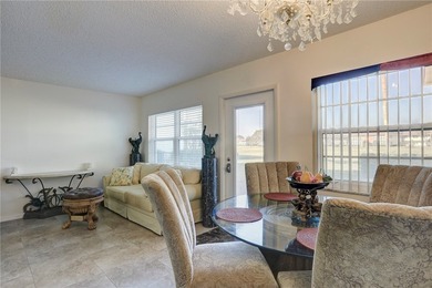 Charming first-floor condo with golf and green space views plus on The American Golf Club in Florida - for sale on GolfHomes.com, golf home, golf lot