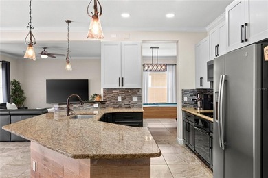 Beautiful Water-View Pool Home in Gated Golf Course Community - on Stoneybrook West in Florida - for sale on GolfHomes.com, golf home, golf lot