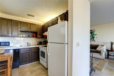 Charming first-floor condo with golf and green space views plus on The American Golf Club in Florida - for sale on GolfHomes.com, golf home, golf lot