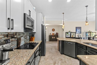 Beautiful Water-View Pool Home in Gated Golf Course Community - on Stoneybrook West in Florida - for sale on GolfHomes.com, golf home, golf lot