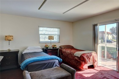 Charming first-floor condo with golf and green space views plus on The American Golf Club in Florida - for sale on GolfHomes.com, golf home, golf lot