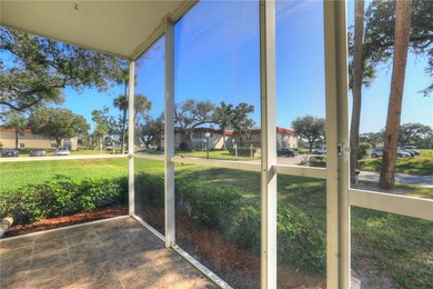 Charming first-floor condo with golf and green space views plus on The American Golf Club in Florida - for sale on GolfHomes.com, golf home, golf lot