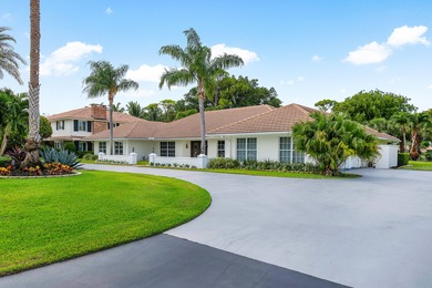 Discover comfortable luxury in this expansive single-story on Atlantis Golf Club in Florida - for sale on GolfHomes.com, golf home, golf lot