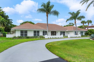 Discover comfortable luxury in this expansive single-story on Atlantis Golf Club in Florida - for sale on GolfHomes.com, golf home, golf lot