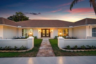 Discover comfortable luxury in this expansive single-story on Atlantis Golf Club in Florida - for sale on GolfHomes.com, golf home, golf lot