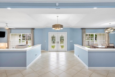 Discover comfortable luxury in this expansive single-story on Atlantis Golf Club in Florida - for sale on GolfHomes.com, golf home, golf lot