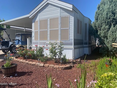 This cozy, bright park model home features a huge covered deck on Juniper Ridge R.V. Golf Resort in Arizona - for sale on GolfHomes.com, golf home, golf lot