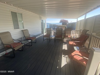 This cozy, bright park model home features a huge covered deck on Juniper Ridge R.V. Golf Resort in Arizona - for sale on GolfHomes.com, golf home, golf lot