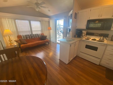This cozy, bright park model home features a huge covered deck on Juniper Ridge R.V. Golf Resort in Arizona - for sale on GolfHomes.com, golf home, golf lot