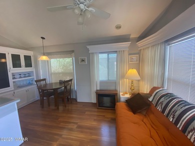 This cozy, bright park model home features a huge covered deck on Juniper Ridge R.V. Golf Resort in Arizona - for sale on GolfHomes.com, golf home, golf lot