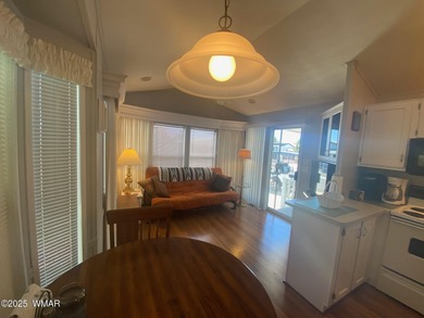 This cozy, bright park model home features a huge covered deck on Juniper Ridge R.V. Golf Resort in Arizona - for sale on GolfHomes.com, golf home, golf lot