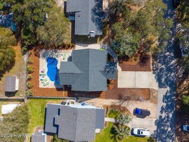 Coastal charm and a fantastic location come together in this on Oak Island Golf Club in North Carolina - for sale on GolfHomes.com, golf home, golf lot