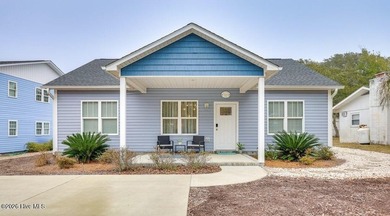 Coastal charm and a fantastic location come together in this on Oak Island Golf Club in North Carolina - for sale on GolfHomes.com, golf home, golf lot