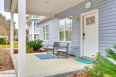 Coastal charm and a fantastic location come together in this on Oak Island Golf Club in North Carolina - for sale on GolfHomes.com, golf home, golf lot