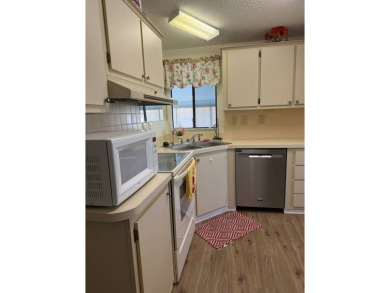 This lovely, 2/2 manufactured home is on leased land. Located in on Pine Lakes Country Club in Florida - for sale on GolfHomes.com, golf home, golf lot
