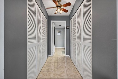 Enjoy convenience, privacy, and security in this light-filled on Belleair Country Club in Florida - for sale on GolfHomes.com, golf home, golf lot