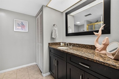 Enjoy convenience, privacy, and security in this light-filled on Belleair Country Club in Florida - for sale on GolfHomes.com, golf home, golf lot