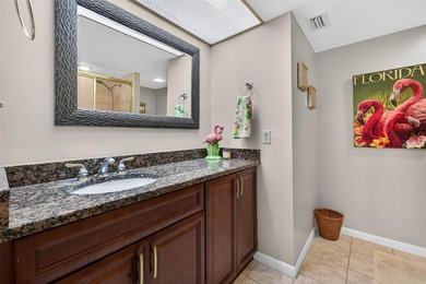 Enjoy convenience, privacy, and security in this light-filled on Belleair Country Club in Florida - for sale on GolfHomes.com, golf home, golf lot