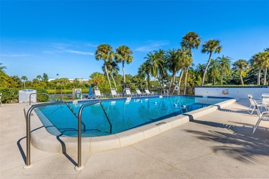 Enjoy convenience, privacy, and security in this light-filled on Belleair Country Club in Florida - for sale on GolfHomes.com, golf home, golf lot