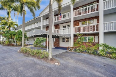 GROUND LEVEL CONDO WITH STUNNING LAKE & GOLF VIEWS Discover on Atlantis Golf Club in Florida - for sale on GolfHomes.com, golf home, golf lot