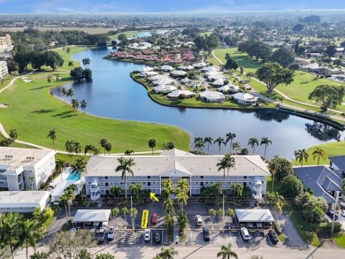 GROUND LEVEL CONDO WITH STUNNING LAKE & GOLF VIEWS Discover on Atlantis Golf Club in Florida - for sale on GolfHomes.com, golf home, golf lot