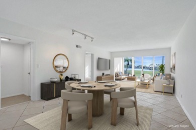 GROUND LEVEL CONDO WITH STUNNING LAKE & GOLF VIEWS Discover on Atlantis Golf Club in Florida - for sale on GolfHomes.com, golf home, golf lot