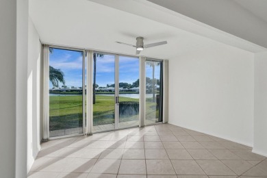 GROUND LEVEL CONDO WITH STUNNING LAKE & GOLF VIEWS Discover on Atlantis Golf Club in Florida - for sale on GolfHomes.com, golf home, golf lot