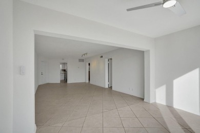 GROUND LEVEL CONDO WITH STUNNING LAKE & GOLF VIEWS Discover on Atlantis Golf Club in Florida - for sale on GolfHomes.com, golf home, golf lot